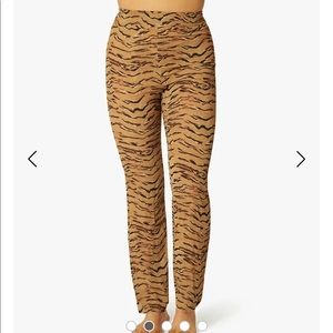 WeWoreWhat smocked flare tiger print pants.